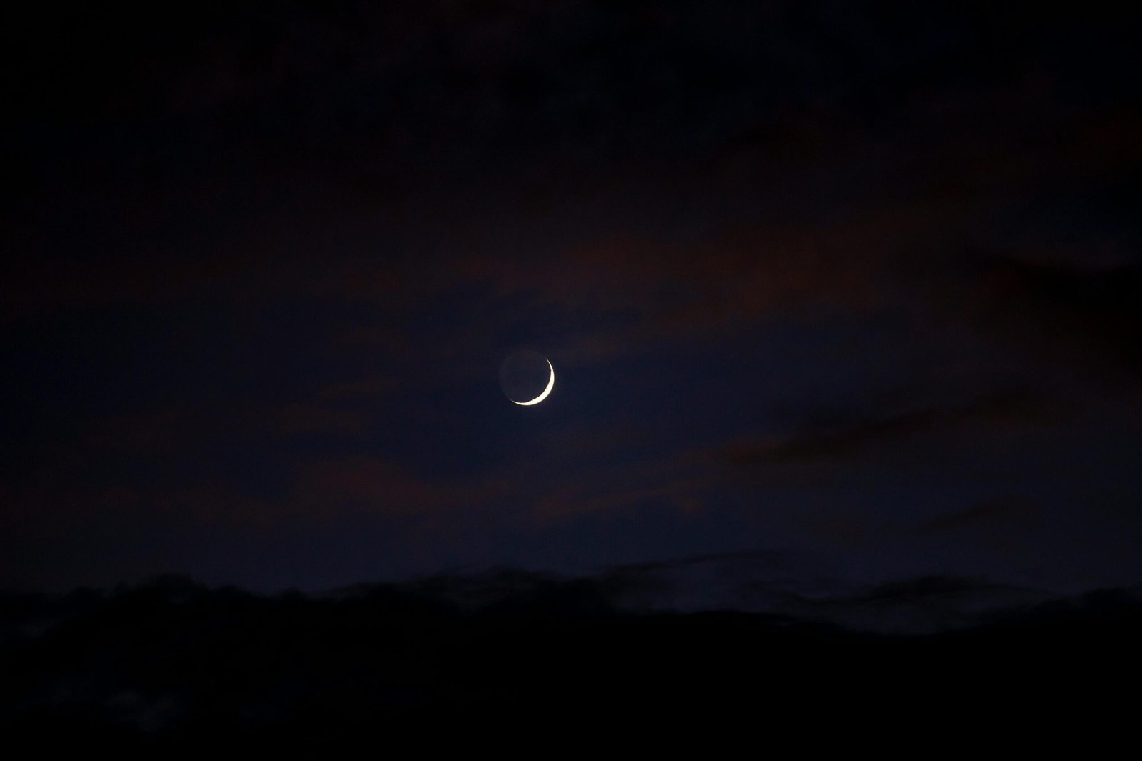 A Muslim praying Qiyam al-Layl at night — the night prayer in Islam